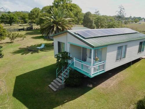an aerial view of a house with a solar roof at Lowood Riverelle Cottage in Lowood