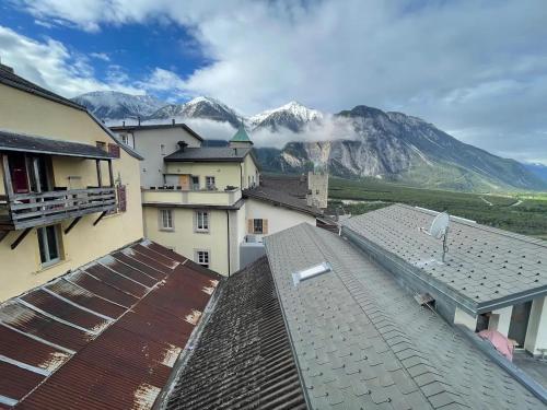 a view of the mountains from the roofs of buildings at Stay in the Heart of Wallis in Leuk