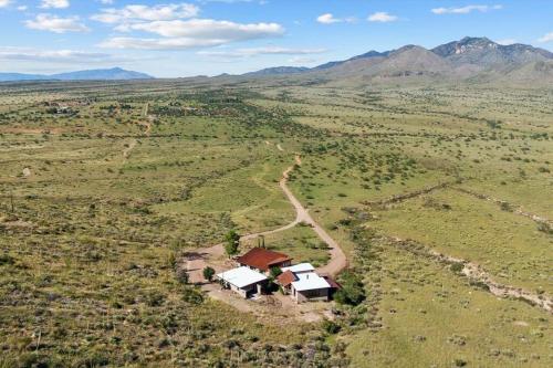 an aerial view of a house in the middle of a field at Ranch in Elgin