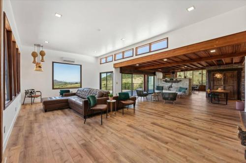 a large living room with a couch and chairs at Ranch in Elgin