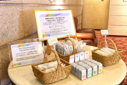 a table with wicker baskets and pamphlets on it at Daiichi Inn Ikebukuro in Tokyo