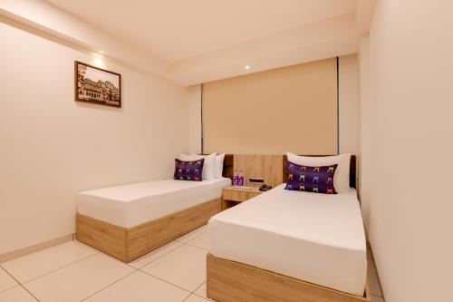 Cama o camas de una habitación en Keys Lite by Lemon Tree Hotels, Vadodara