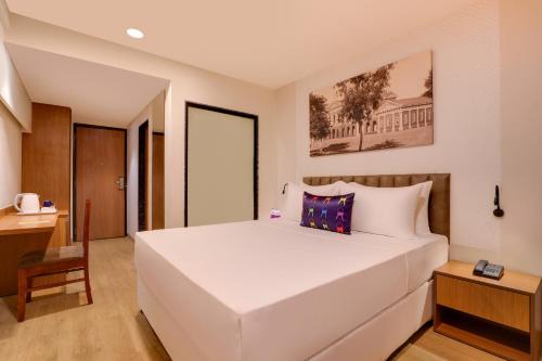 Cama o camas de una habitación en Keys Lite by Lemon Tree Hotels, Vadodara