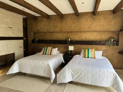 Postel nebo postele na pokoji v ubytování Porta Paradiso ValQuirico, Albergo Boutique