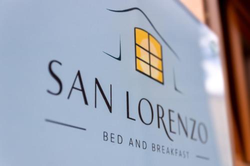 a bottle of san lorenzo wine with the words san lorenzo at San Lorenzo B & B in Ruoti
