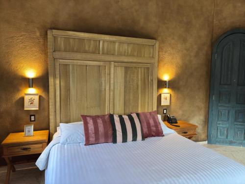 Postel nebo postele na pokoji v ubytování Porta Paradiso ValQuirico, Albergo Boutique