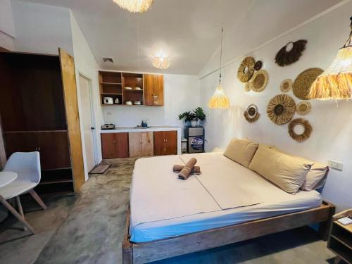 a bedroom with a large bed in a room at Dee Siargaonon Homestay in General Luna