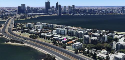 an aerial view of a city with a river and buildings at Moon River, South Perth in Perth