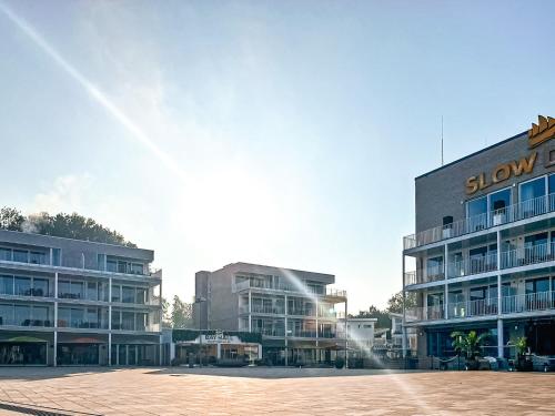 a group of buildings in a parking lot at Strandblick - Dorf 1 Ferienhaus 01 in Priwall