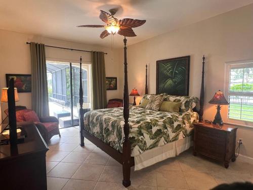 a bedroom with a bed and a ceiling fan at Imperial Paradise Naples in Bonita Springs