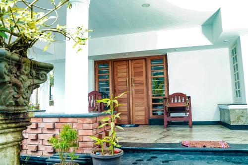 Φωτογραφία από το άλμπουμ του Bougain Villa Service Villa σε Wayanad
