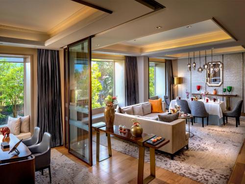 a living room with a couch and a table at Welcomhotel by ITC Hotels, Raja Sansi, Amritsar in Amritsar