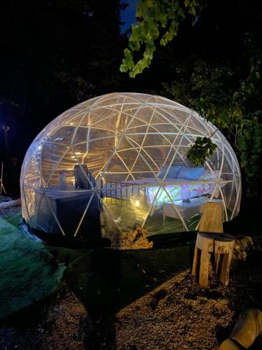 an object in a dome is lit up at night at Casa Tatisita Buhardilla in Segura de la Sierra