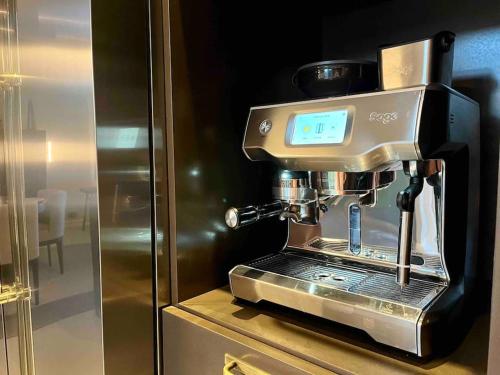 a coffee machine sitting on top of a counter at Luxurious villa - exceptional location in city center with free P in Odense