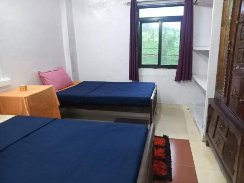 Postel nebo postele na pokoji v ubytování Ambika Villa 3 bedrooms homestay in Vagamon