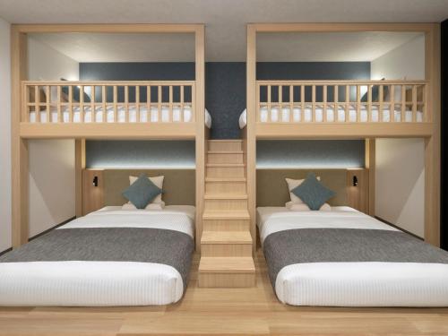 Postel nebo postele na pokoji v ubytování HOTEL MYSTAYS Iidabashi
