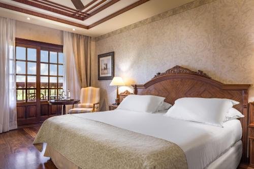 Ένα ή περισσότερα κρεβάτια σε δωμάτιο στο Elba Palace Golf Boutique Hotel - Adults Only