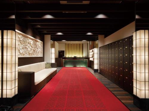 a red carpet in a hallway with a red carpet at Sakuraan Kawaguchiko Hotel in Fujikawaguchiko