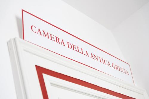 a sign for the american dental association of america at CASABONA1910 bed&breakfast in Vercelli