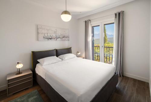 Postel nebo postele na pokoji v ubytování Lustica Bay Apartment - Centrale 4503