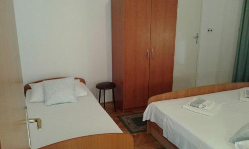 Postel nebo postele na pokoji v ubytování Apartments Josip