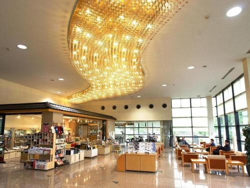 a large chandelier hanging from the ceiling of a store at Kyoto Keburikawa Hotel in Kameoka