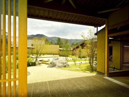 a view from the inside of a house with a patio at Kyoto Keburikawa Hotel in Kameoka