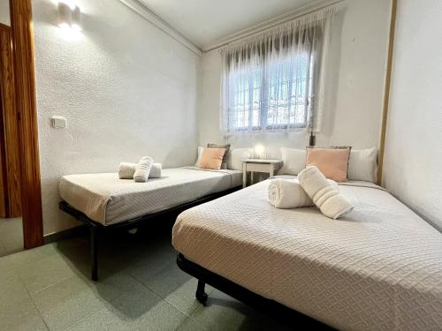 En eller flere senge i et værelse på Niza 8 by United Renters