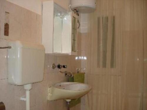 a bathroom with a sink and a mirror at House Boris in Slatine