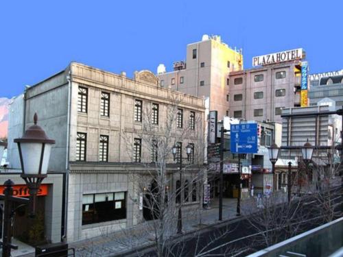 a city street with tall buildings and a street light at Ueda Plaza Hotel in Ueda