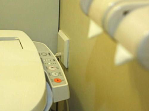 a close up of a toilet in a bathroom at Ueda Plaza Hotel in Ueda