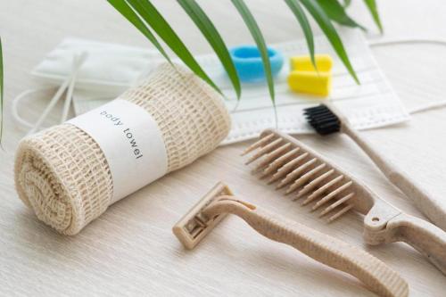 a wooden table with a comb and a toothbrush at Hotel Oriental Express Nagoya Sakae in Nagoya