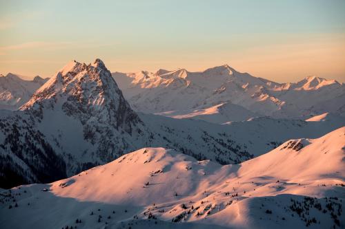 a view of a mountain range with snow covered mountains at Chalet 104 Westendorf by ALPS RESORTS in Westendorf