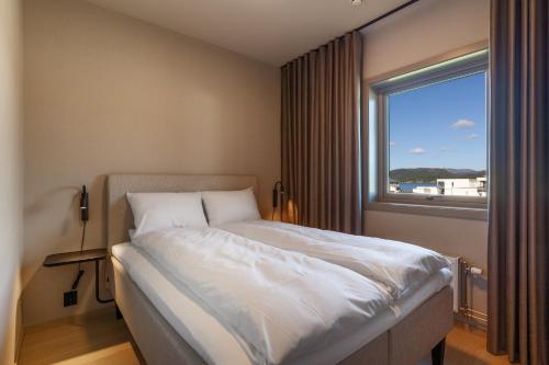 Postel nebo postele na pokoji v ubytování Bjugn Hotell