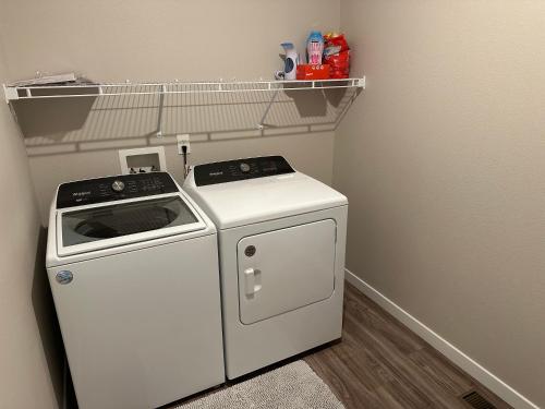 a small kitchen with a stove and a shelf at NDSU Close #103 Relax and enjoy Fargo! in Fargo