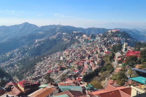an aerial view of a city on a mountain at Pingaksh Villa in Shimla
