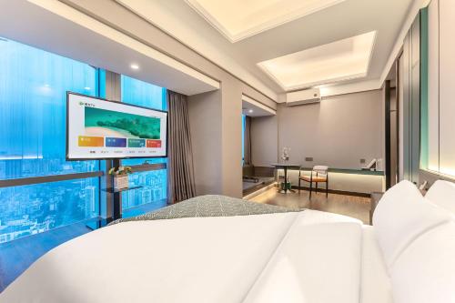 Μια τηλεόραση ή/και κέντρο ψυχαγωγίας στο STAR STAGE International Apartment Hotel - 1min to Line2 & Line8 ChangGang STN-Free private car delivery to Canton Fair from Otc 15th to Nov 4th