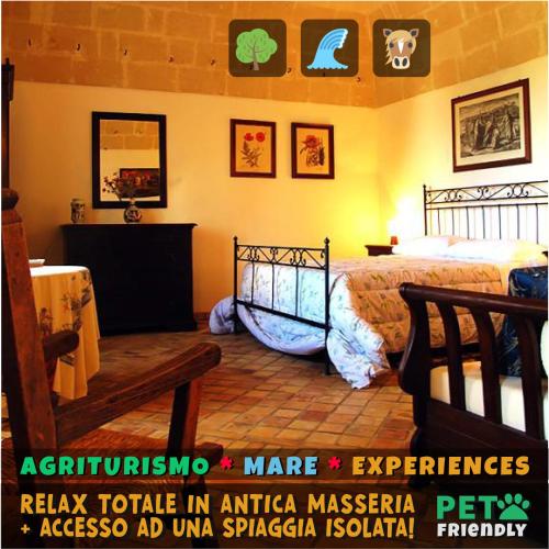 a bedroom with a bed and a table in a room at Agriturismo La Stornara, Petfriendly & EV Friendly in Ginosa Marina