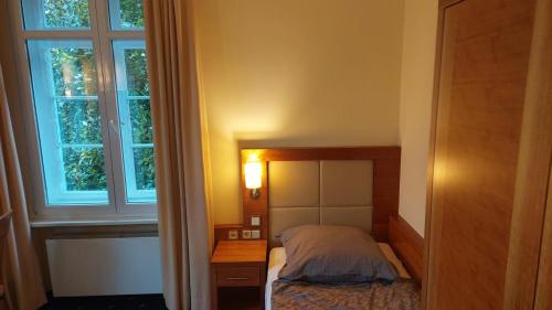 Ένα ή περισσότερα κρεβάτια σε δωμάτιο στο die Villa, Zimmer 25, EZ