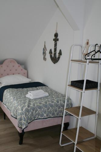 a bedroom with a bunk bed and a ladder at Seehafen Hostel in Hamburg