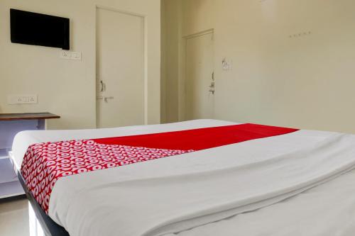 Ένα ή περισσότερα κρεβάτια σε δωμάτιο στο Hotel O Happy Homely Stay