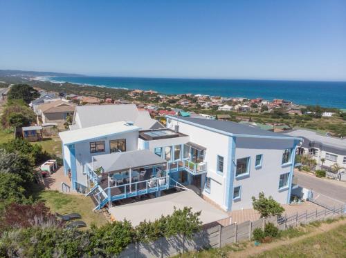 an aerial view of a house with the ocean in the background at Blue Star Villa in Tergniet