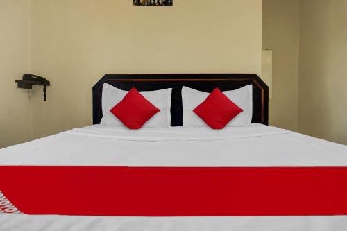 Ένα ή περισσότερα κρεβάτια σε δωμάτιο στο Hotel O Happy Homely Stay