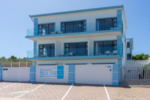 a building with a blue sing sign in front of it at Blue Star Villa in Tergniet