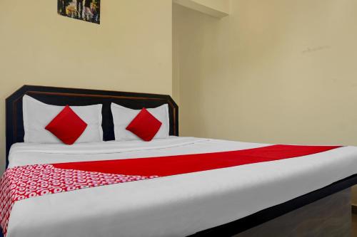 Ένα ή περισσότερα κρεβάτια σε δωμάτιο στο Hotel O Happy Homely Stay