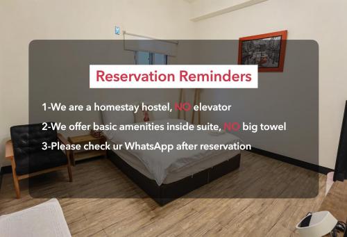 a room with a sign that says reservation reminders at OC Hostel in Tainan