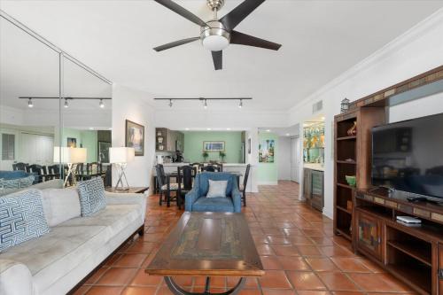 a living room with a couch and a ceiling fan at Key West's Best in Key West