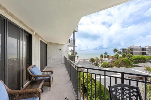 a balcony with chairs and a view of the ocean at Key West's Best in Key West