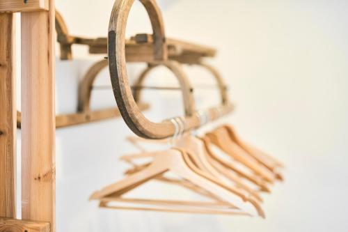 a mirror hanging on a wall next to a shelf at Gästehaus Zeitraum in Admont