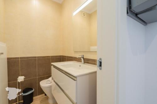 a bathroom with a sink and a toilet at CostaBlancaDreams Casa Tinick in Calpe in Empedrola